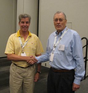 John Barwis congratulates Steve Walske, who with Richard Frajola, won the Stanley Ashbrook Cup for their book